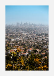 Photography wall art of a city skyline with green suburbs and tree lined streets.