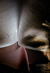 Ship bow reflecting the water.